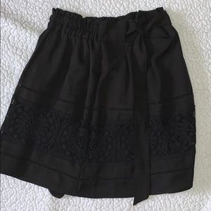 black mid-length skirt